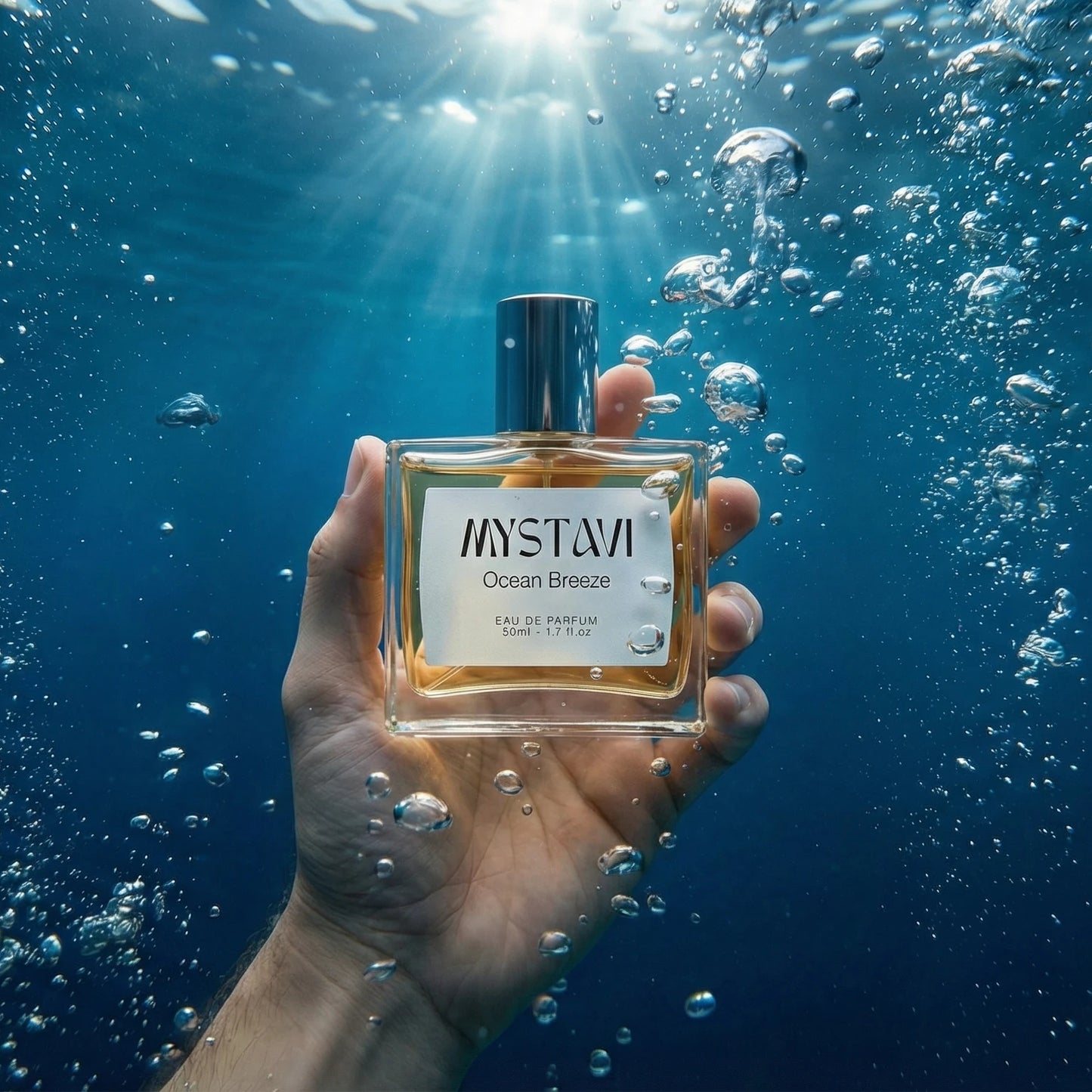 Mystavi Ocean Breeze Eau De Parfum bottle held underwater representing fresh aqua fragrance